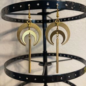 Antique gold colored crescent moon earrings.